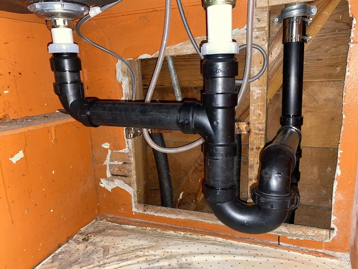 Professional Garbage Disposal Repair equipment and tools on the job in Henrietta